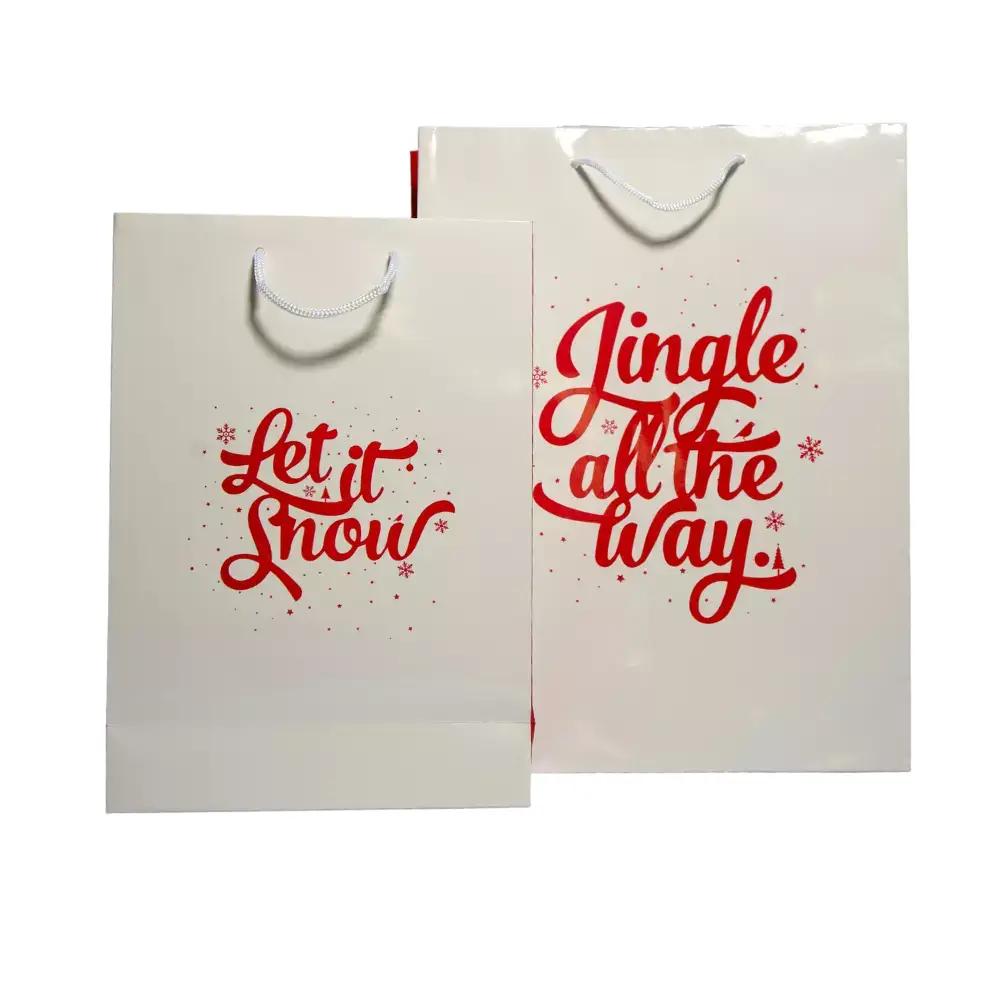 Sacs en papier luxe pelliculé "Jingle all the way" à poignées cordelettes